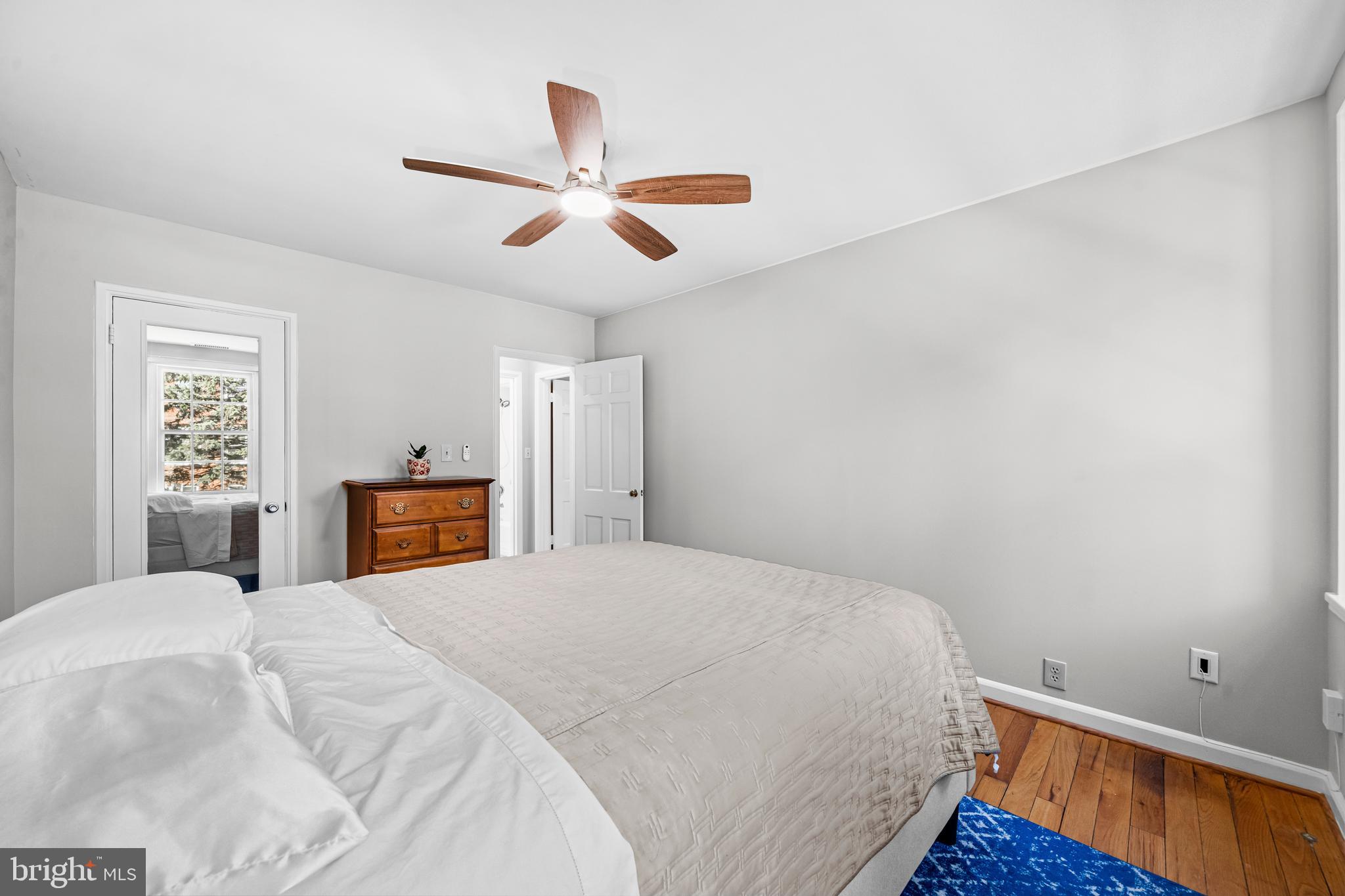 3861 Porter Street Northwest, Unit C285 Washington, DC 20016 - Photo 16 of 23 a bed room with a bed and a window