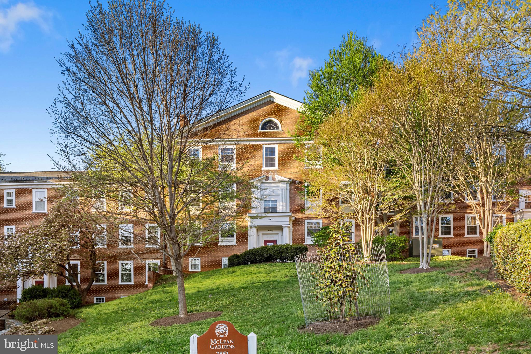 3861 Porter Street Northwest, Unit C285 Washington, DC 20016 - Photo 21 of 23 a front view of a house with a garden