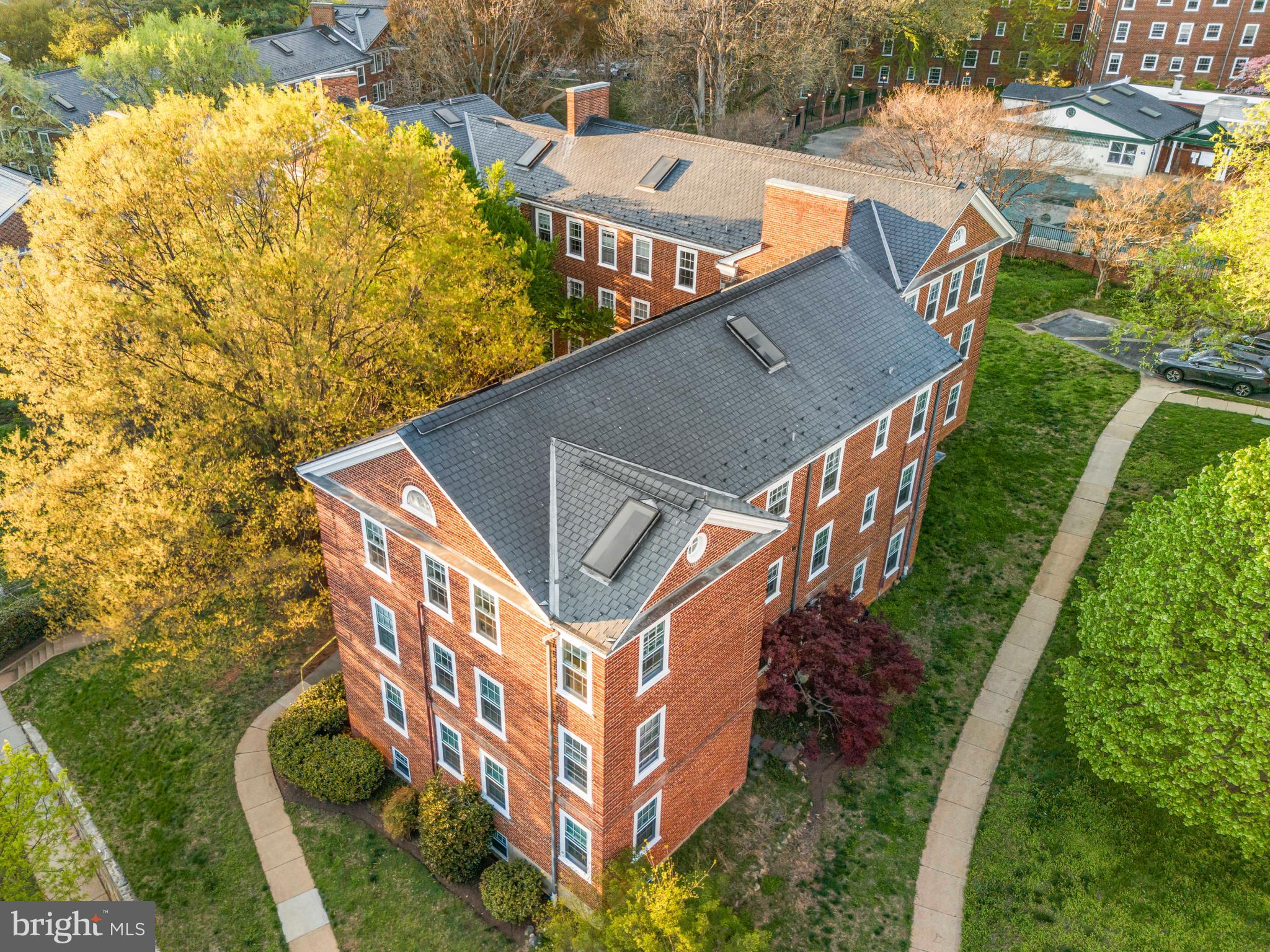 3861 Porter Street Northwest, Unit C285 Washington, DC 20016 - Photo 22 of 23 a aerial view of a house with a yard