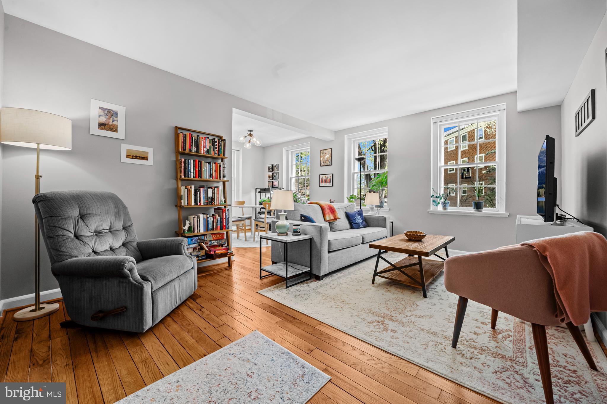3861 Porter Street Northwest, Unit C285 Washington, DC 20016 - Photo 3 of 23 a living room with furniture and a wooden floor