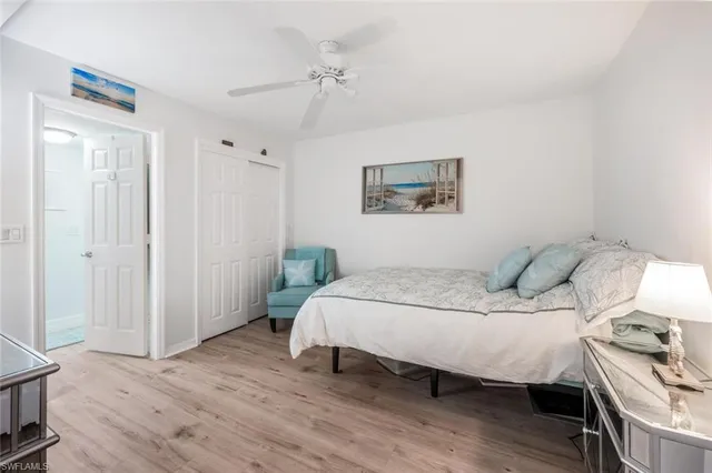 a bedroom with a bed and a table