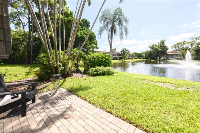 a view of a lake with a house in the background
