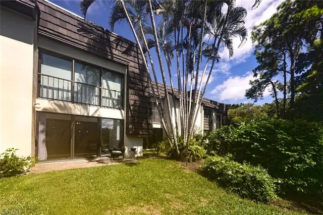 a view of house with yard
