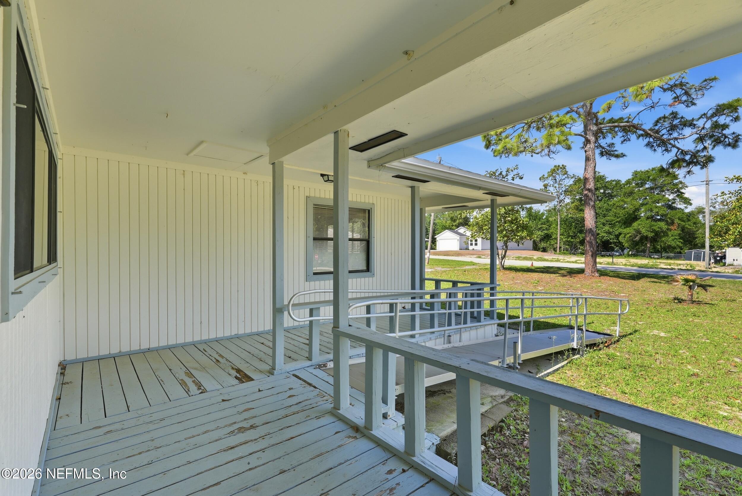 7593 Silver Sands Road Keystone Heights, FL 32656 - Photo 3 of 36 a view of balcony with wooden floor
