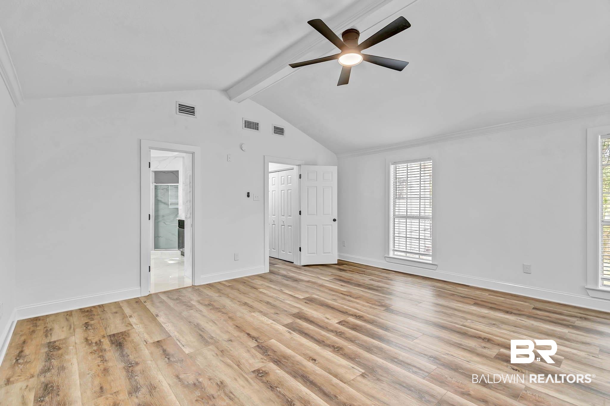 4705 Sherry Court Mobile, AL 36693 - Photo 37 of 100 Unfurnished bedroom featuring beamed ceiling, light wood finished floors, a ceiling fan, ensuite bathroom, and high vaulted ceiling