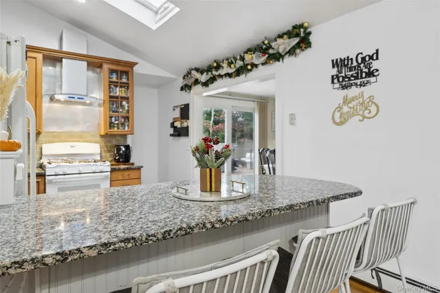 a view of a living room and kitchen