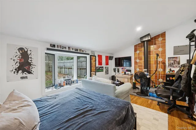 a bed room with a bed and a large window