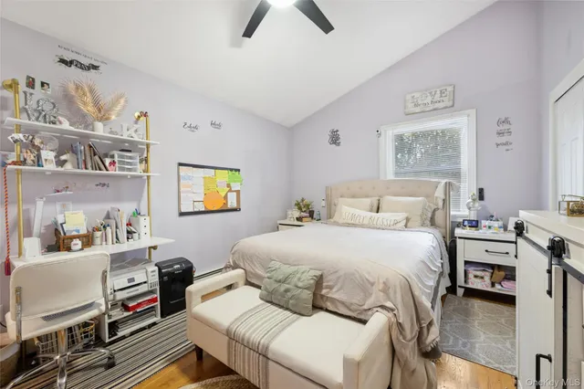 a bedroom with a bed and dresser