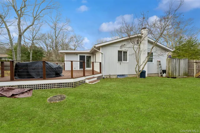 a front view of house with a garden and patio