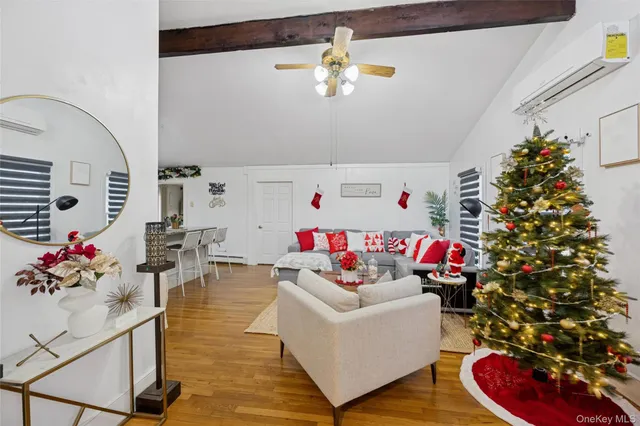 a living room with furniture and flowers