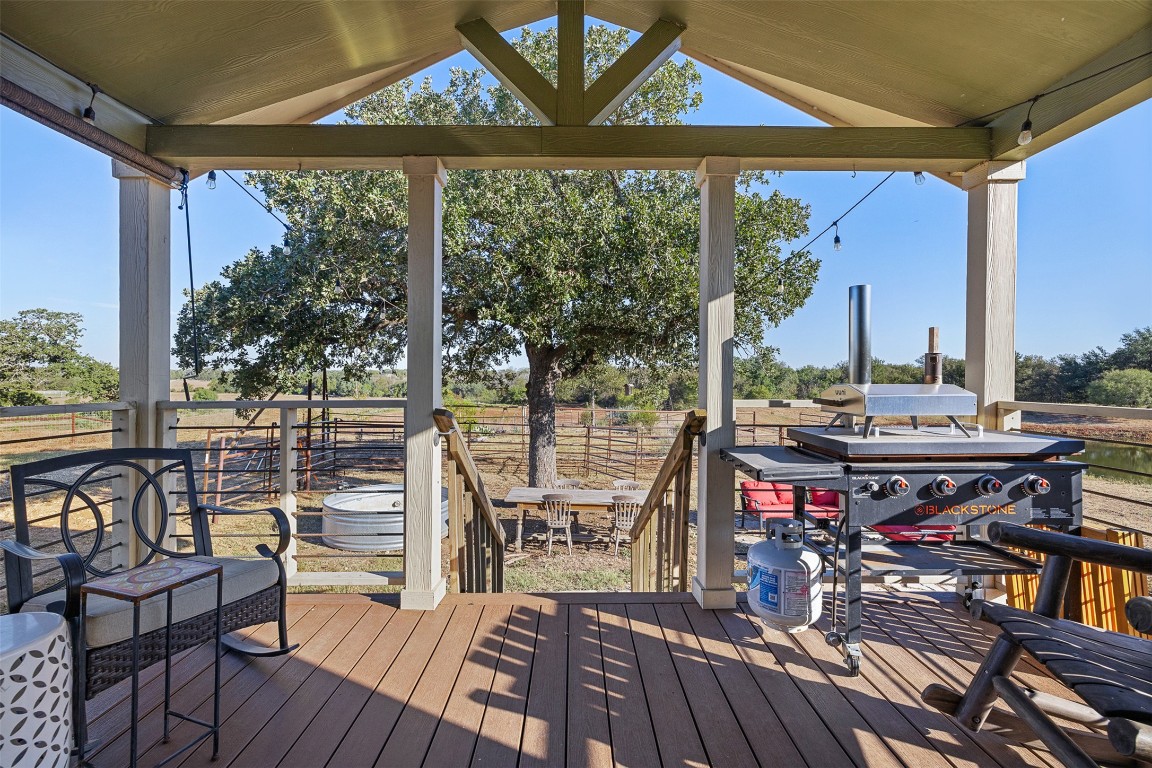 3270 Fm 671 Luling, TX 78648 - Photo 4 of 35 a view of a balcony with chairs and wooden floor
