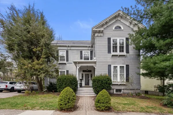 front view of a house with a yard