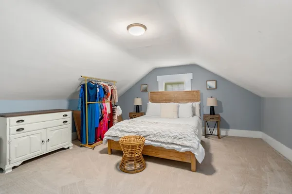 a bedroom with a bed and a closet