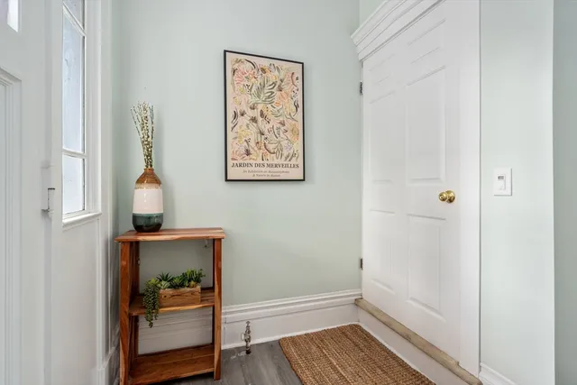 a view of hallway with wooden floor