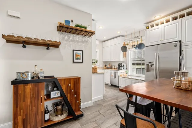 a view of kitchen with furniture and wooden floor