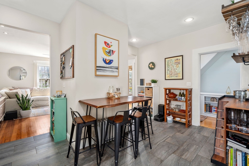 27 Champa Street, Unit 2 Newton, MA 02464 - Photo 6 of 16 a view of a dining room with furniture and wooden floor