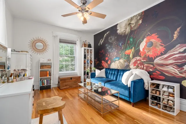 a living room with furniture fireplace and flat screen tv