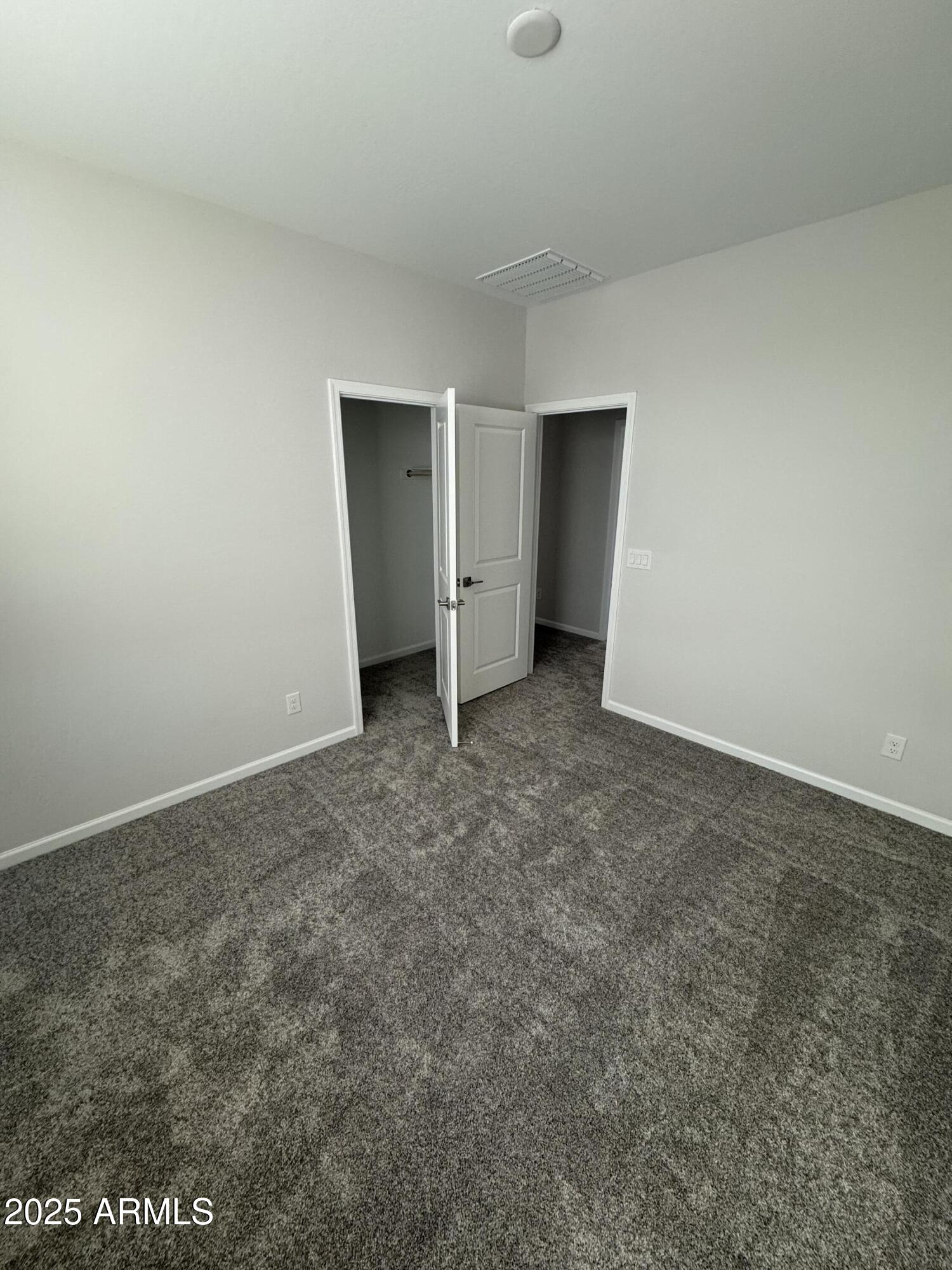 2737 East Boulder Avenue Apache Junction, AZ 85119 - Photo 6 of 22 an empty room with a natural light