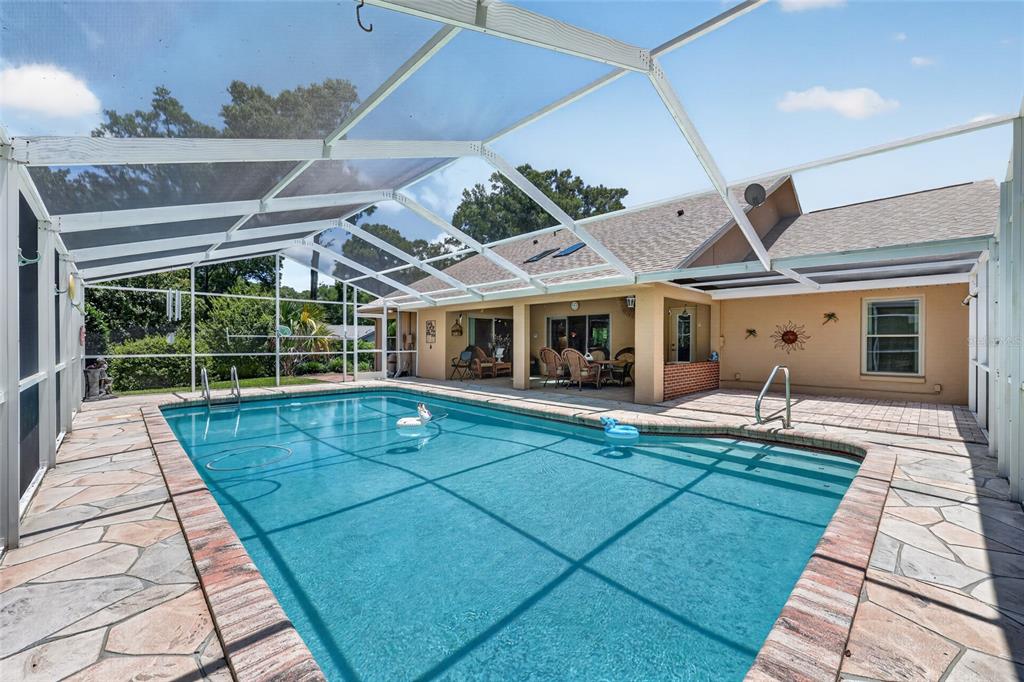 19025 Southwest 98th Loop Dunnellon, FL 34432 - Photo 3 of 80 a view of a house with a swimming pool