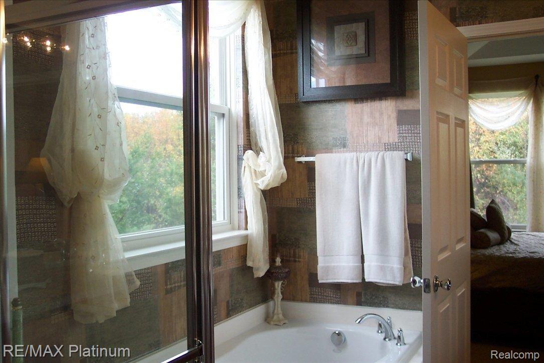 3983 Rainier Drive, Unit 2 Howell, MI 48843 - Photo 8 of 11 master tub