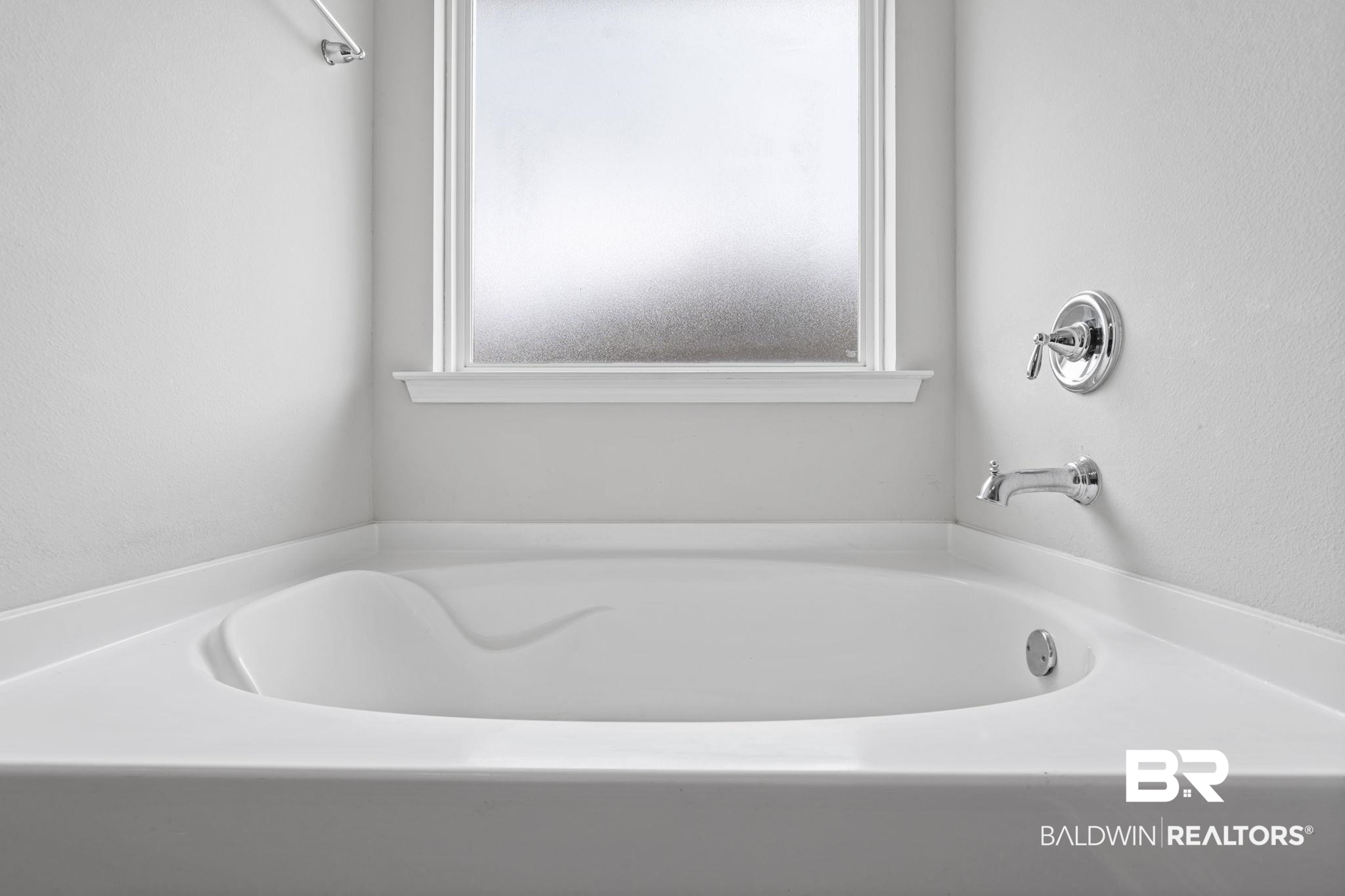 12693 Waxwing Avenue Daphne, AL 36527 - Photo 29 of 43 Bathroom with a textured wall and a garden tub