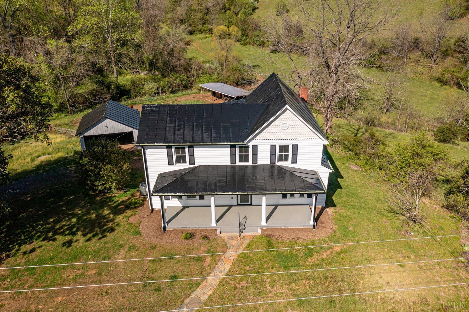 237 Lexington Turnpike Amherst, VA 24521 - Photo 14 of 56 a house view with a garden space