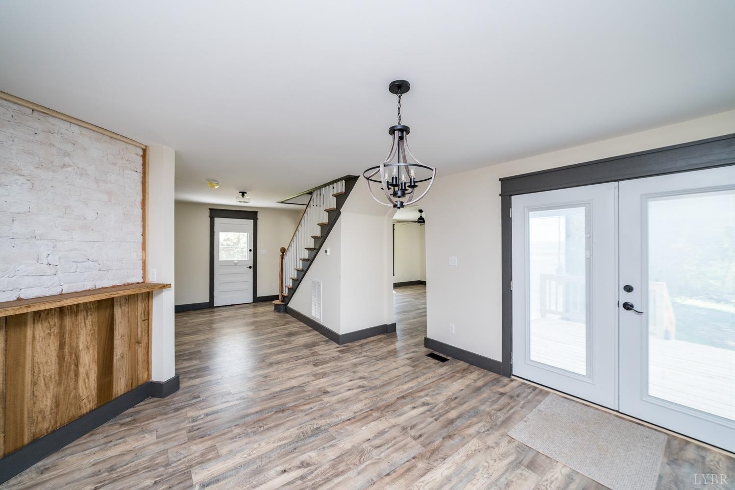237 Lexington Turnpike Amherst, VA 24521 - Photo 27 of 56 a view of a hallway with wooden floor and staircase