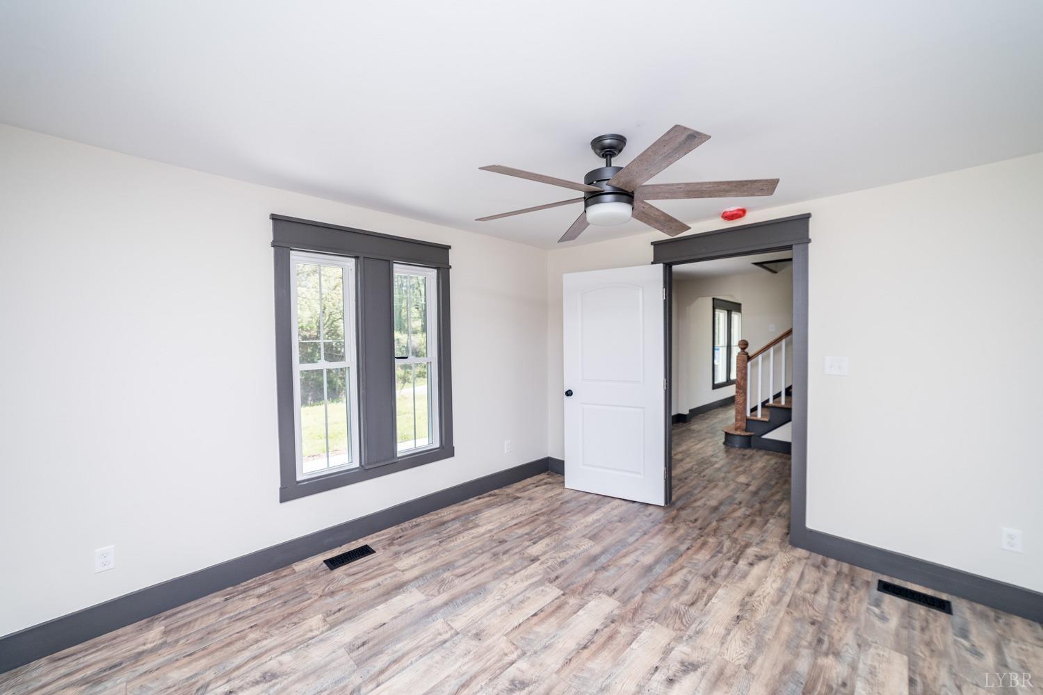237 Lexington Turnpike Amherst, VA 24521 - Photo 39 of 56 a view of a livingroom with a ceiling fan and window