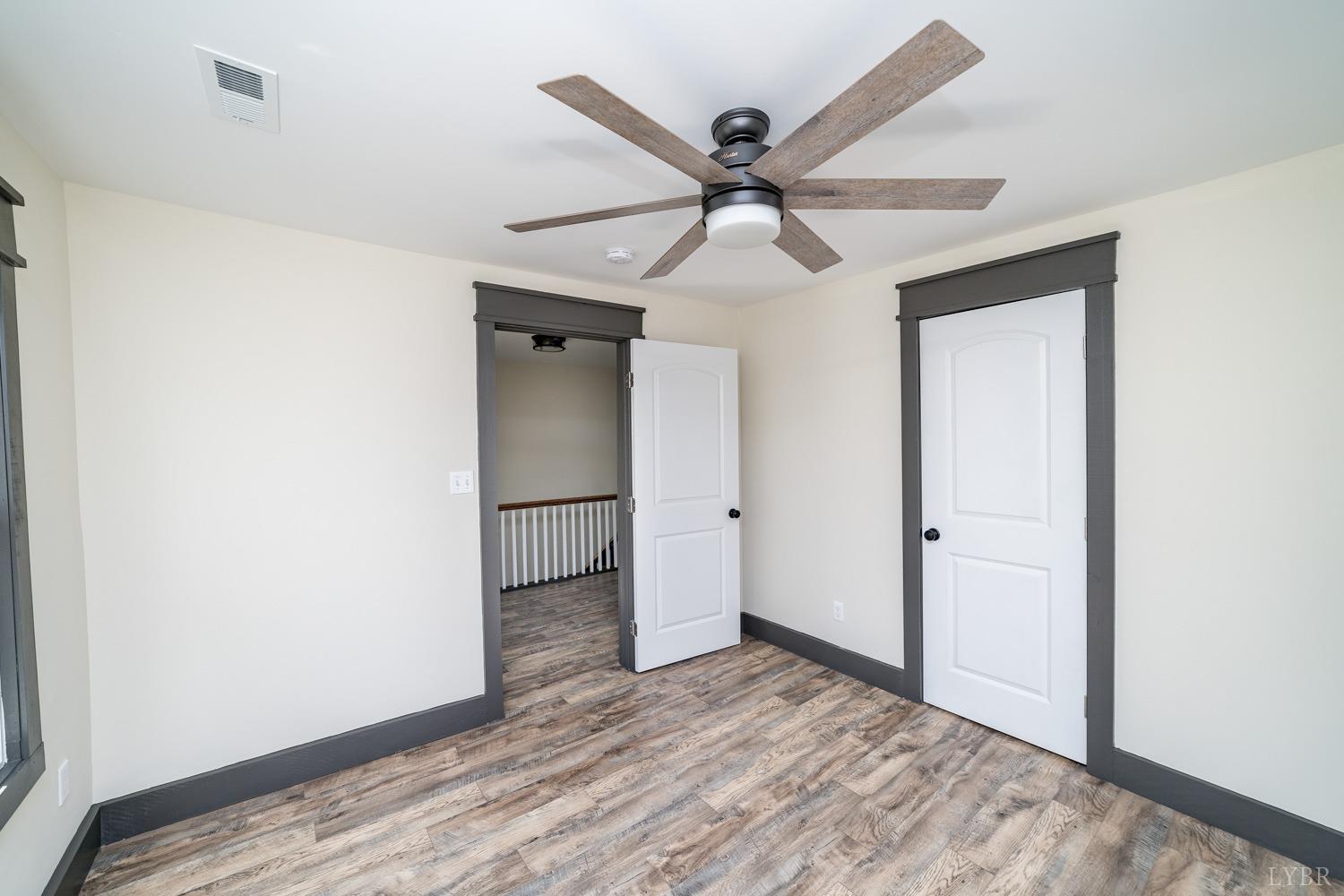 237 Lexington Turnpike Amherst, VA 24521 - Photo 50 of 56 a view of a big room with wooden floor and windows in a room
