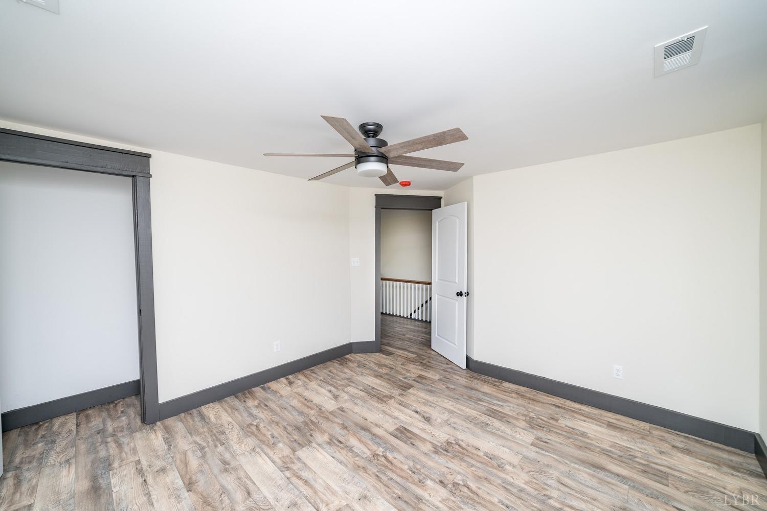 237 Lexington Turnpike Amherst, VA 24521 - Photo 52 of 56 a view of a livingroom with wooden floor and a ceiling fan