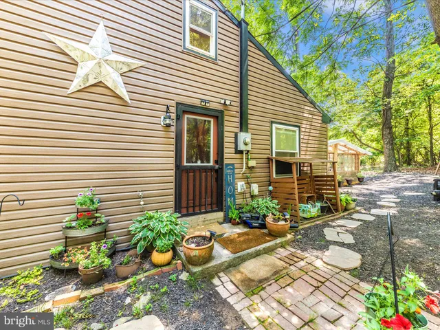 a view of a chairs and table in a patio