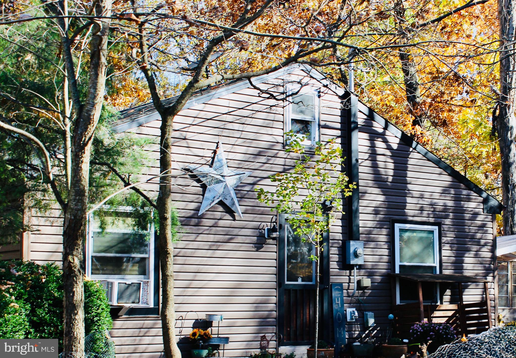 5103 Red Hill Road Keedysville, MD 21756 - Photo 3 of 78 a yellow house with trees in front of it