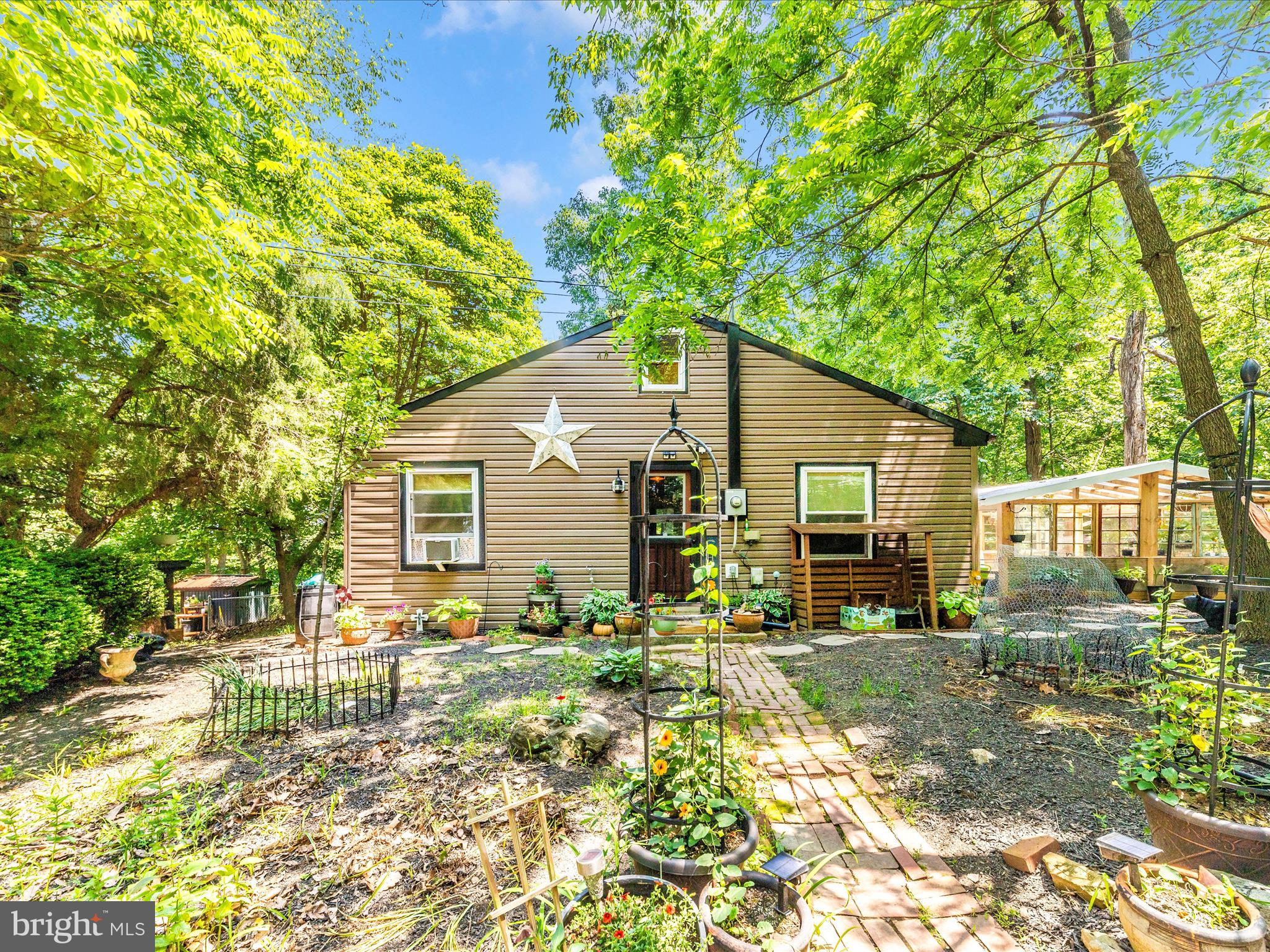5103 Red Hill Road Keedysville, MD 21756 - Photo 62 of 78 a backyard of a house with table and chairs
