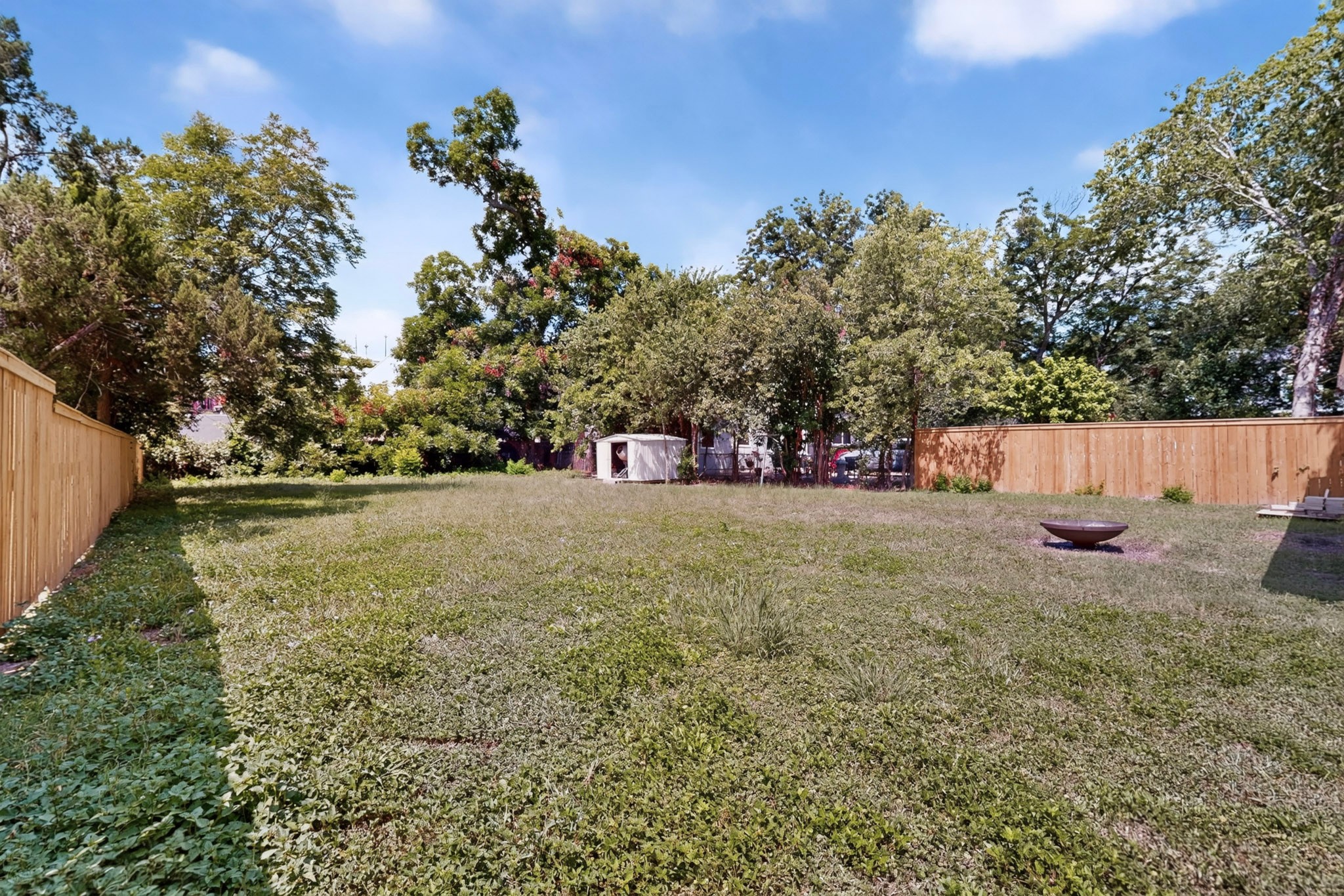 4711 Alf Avenue Austin, TX 78721 - Photo 34 of 34 A spacious backyard with mature treesfire pit, and storage shed