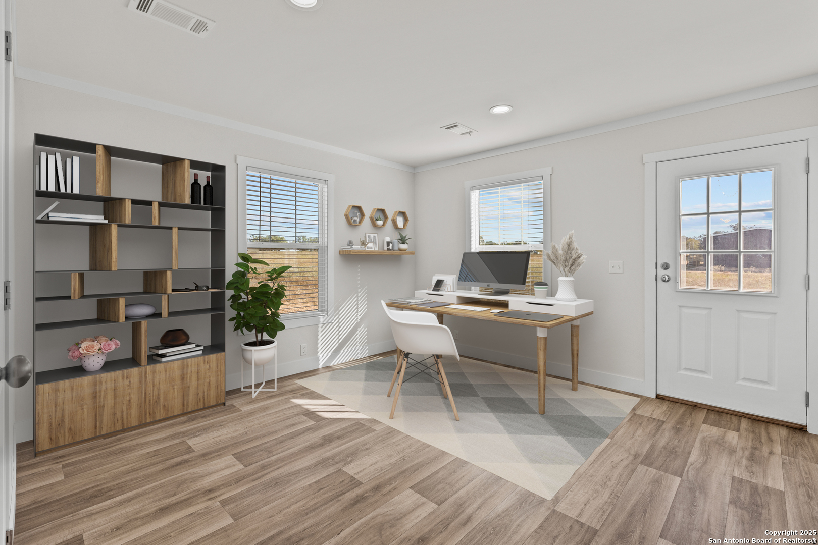 2354 Stevens Road Somerset, TX 78069 - Photo 18 of 22 a workspace with furniture window and wooden floor