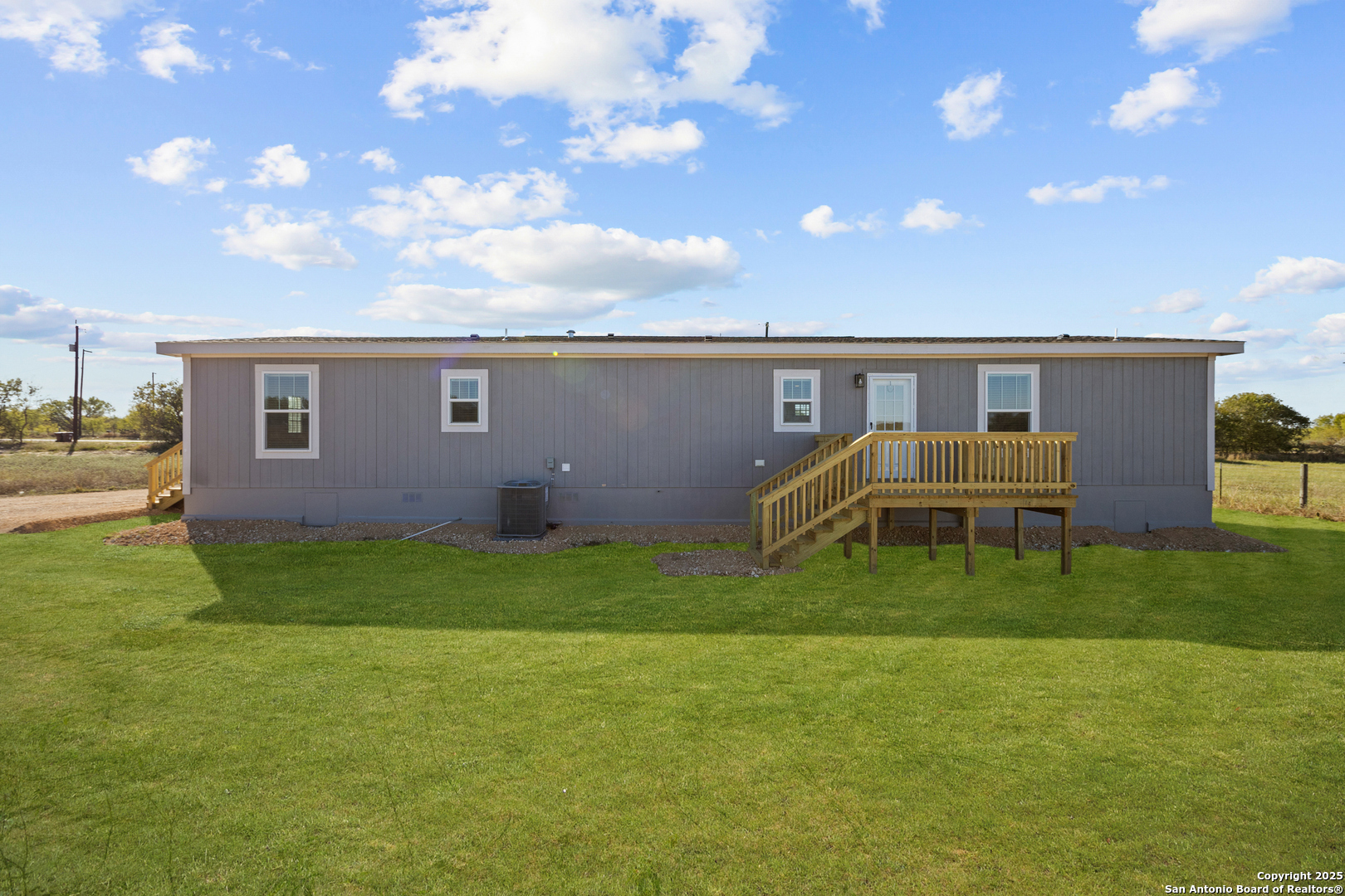 2354 Stevens Road Somerset, TX 78069 - Photo 21 of 22 a backyard of a house with table and chairs