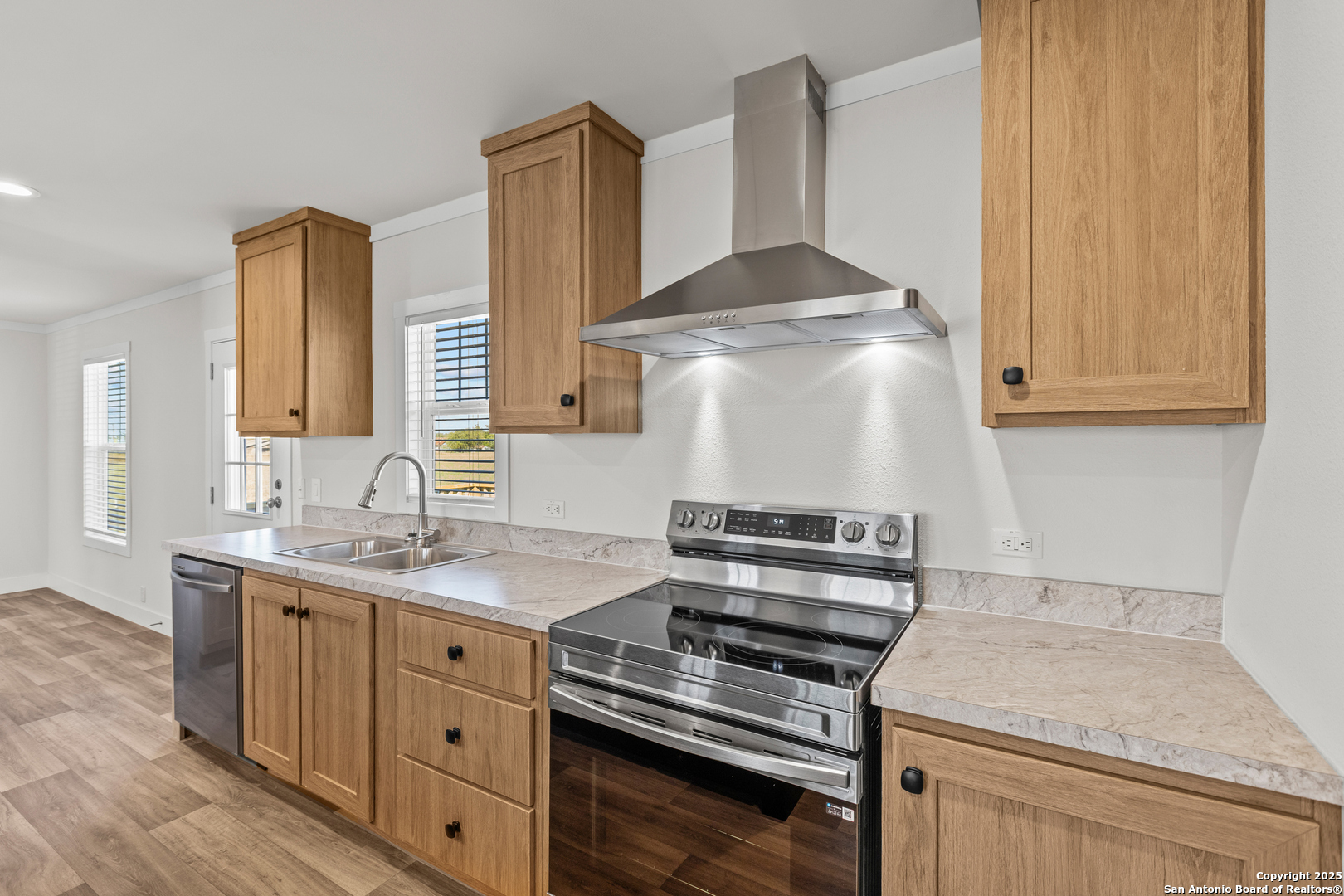2354 Stevens Road Somerset, TX 78069 - Photo 9 of 22 a kitchen with a stove and a sink