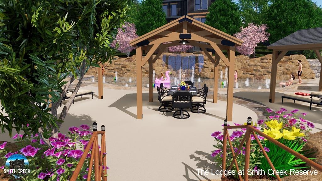 288 Rambling Creek Way, Unit LOT 79R Sevierville, TN 37862 - Photo 20 of 40 a view of a white house with a flower garden