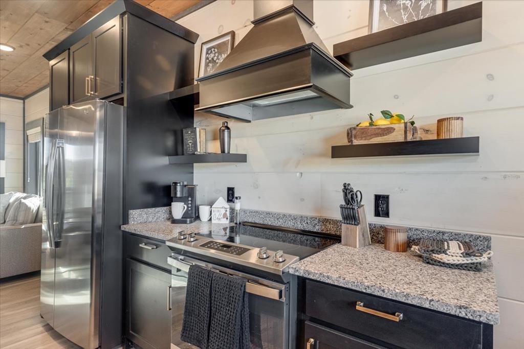 288 Rambling Creek Way, Unit LOT 79R Sevierville, TN 37862 - Photo 26 of 40 a kitchen with stainless steel appliances granite countertop a sink a stove and cabinets