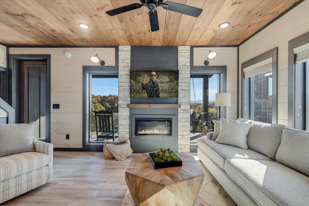 288 Rambling Creek Way, Unit LOT 79R Sevierville, TN 37862 - Photo 31 of 40 a living room with furniture and a fireplace