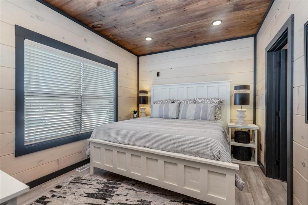 288 Rambling Creek Way, Unit LOT 79R Sevierville, TN 37862 - Photo 34 of 40 a bed sitting in a room next to a window
