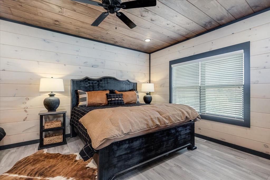 288 Rambling Creek Way, Unit LOT 79R Sevierville, TN 37862 - Photo 37 of 40 a bed sitting in a spacious bedroom next to a window
