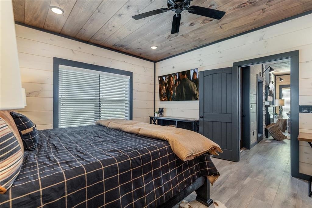 288 Rambling Creek Way, Unit LOT 79R Sevierville, TN 37862 - Photo 38 of 40 a bedroom with a bed and a walk in closet