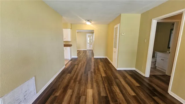 a view of a bathroom from a hallway