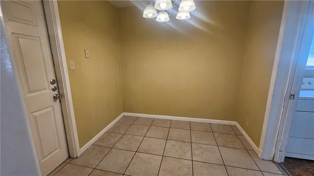 en empty room with wooden floor