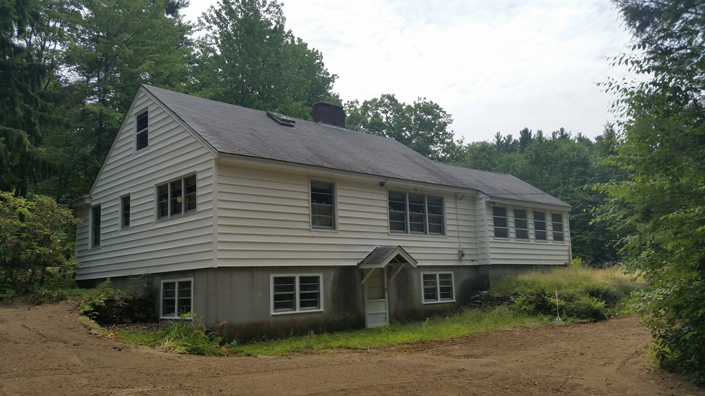 715 Petersham Road Athol, MA 01331 - Photo 3 of 13 a front view of a house with a garden