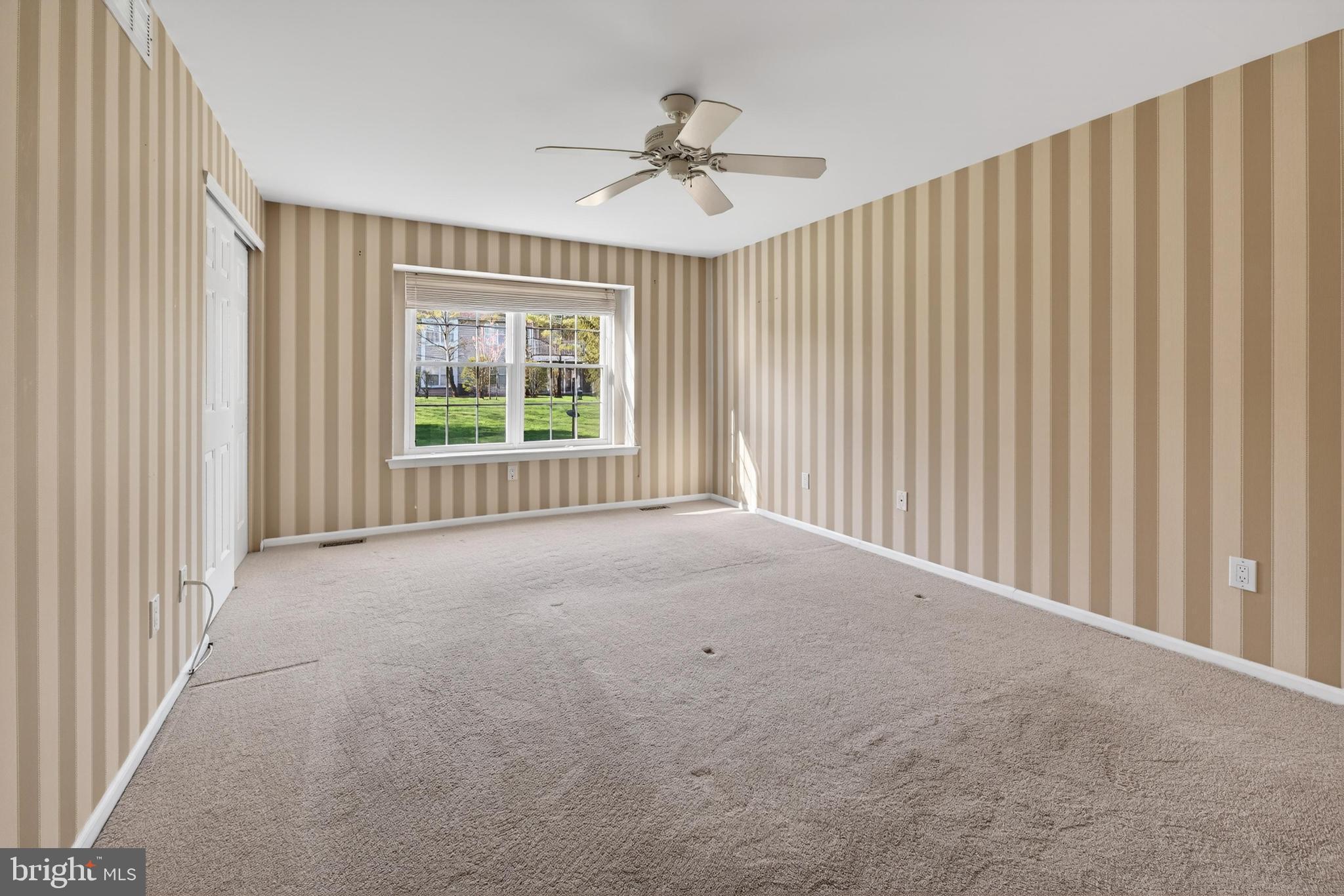 7401A Normandy Drive Mount Laurel, NJ 08054 - Photo 13 of 35 a view of a livingroom with a ceiling fan and window