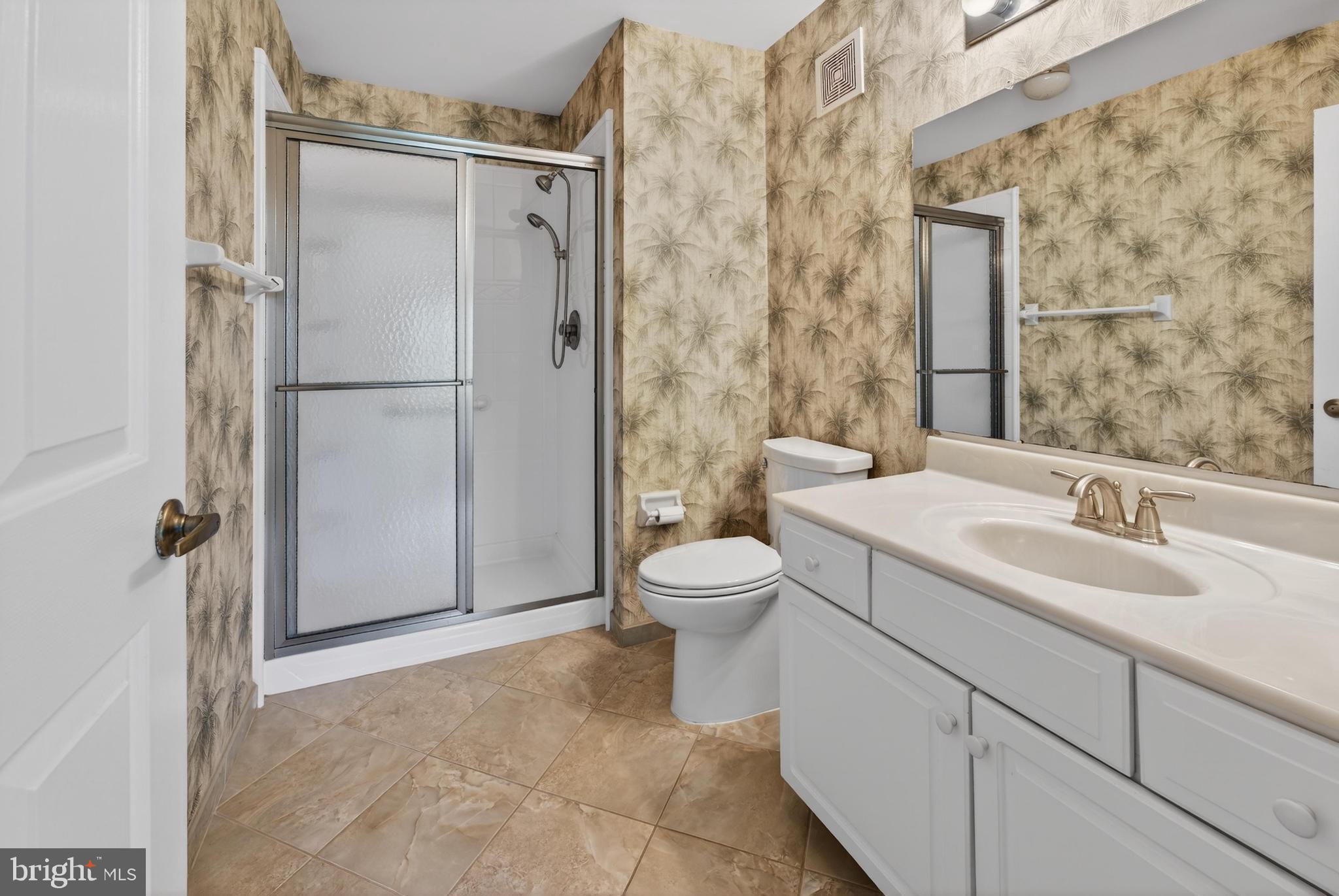 7401A Normandy Drive Mount Laurel, NJ 08054 - Photo 15 of 35 a bathroom with a toilet sink and shower