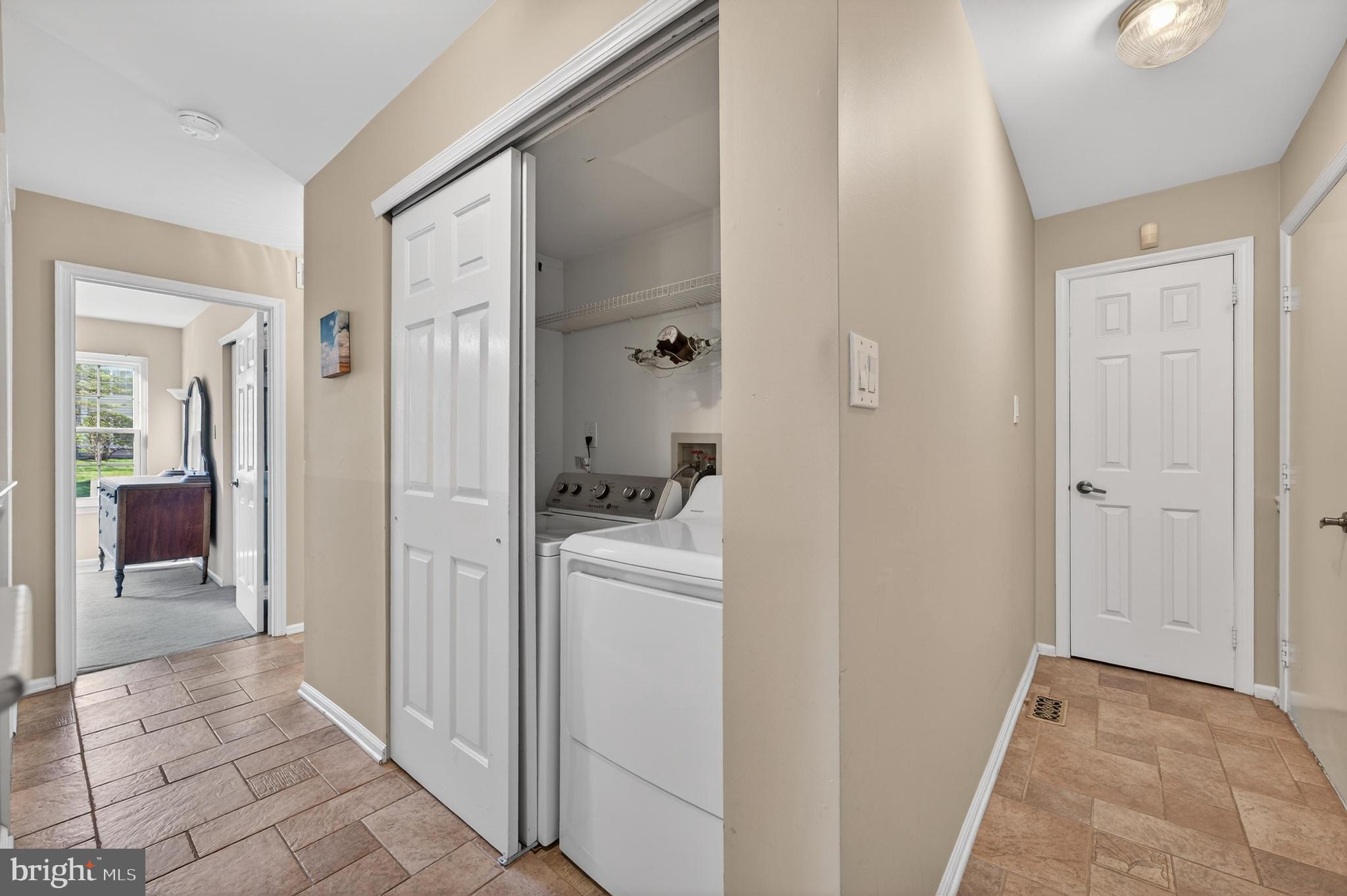 7401A Normandy Drive Mount Laurel, NJ 08054 - Photo 19 of 35 a view of a storage & utility room with closet dryer