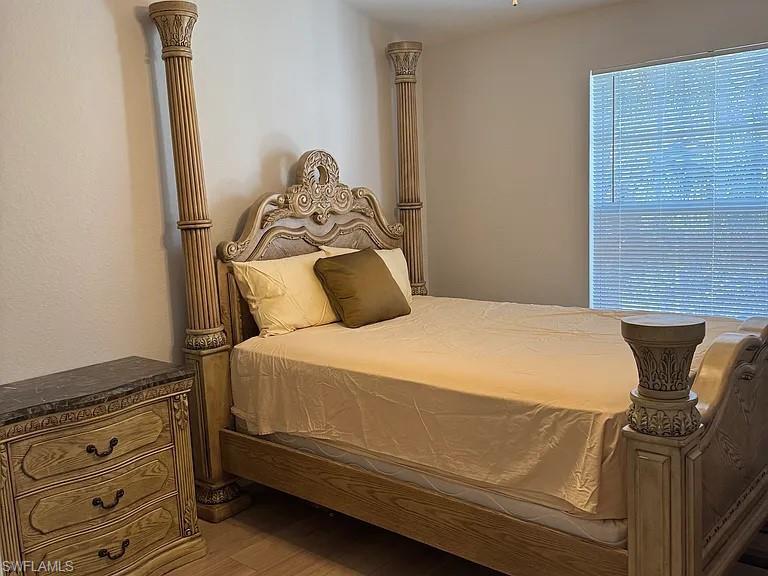 7905 Preserve Circle, Unit 138 Naples, FL 34119 - Photo 12 of 27 a bedroom with a bed and dresser
